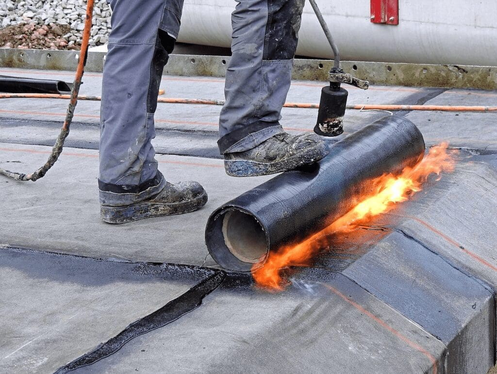 Installing a modified bitumen roof for cost to replace my flat roof.